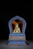 A WHITE JADE BODHISATTVA WITH SILVER GEMS INLAID SHRINE