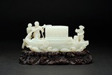A WHITE JADE CARVED 'FIGURES AND BOAT' GROUP