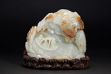 A WHITE JADE CARVED 'LANDSCAPE FIGURES' BOULDER