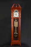 A WESTERN FLOOR STANDING CLOCK