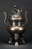 A BRONZE ‘BUDDHIST LION' TRIPOD CENSER