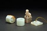 TWO WHITE JADE ARCHER'S RINGS WITH TWO SEALS