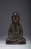 A PARCEL-GILT BRONZE FIGURE OF SEATED GUANYIN