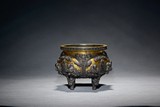 A GILT BRONZE 'FIGURES' REPOUSSE BRONZE CENSER