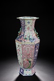 A LARGE CARVED FAMILLE ROSE HEXAGONAL VASE