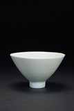 A WHITE GLAZE CONICAL BOWL