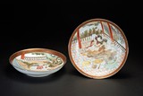 A PAIR OF FAMILLE ROSE 'EROTIC SUBJECT' DISHES