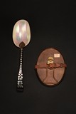 A MOTHER-OF-PEARL SPOON AND TWO BRONZE MIRRORS