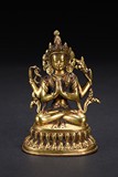 A GILT-BRONZE FIGURE OF SEATED BODHISATTVA