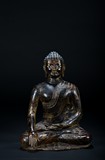 A BRONZE STATUE OF A SEATED BUDDHA
