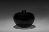 A BLACK-GLAZED JAR