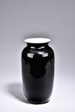 A BLACK GLAZED VASE 