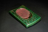 A CARVED GREEN GLAZE INKSTONE