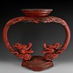 A LACQUER WOOD CARVED DRAGONS STAND