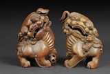 A PAIR OF BAMBOO ROOT GUARDIAN LIONS CARVING