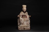 A CARVED WOODEN SEATED CIVIL OFFICIAL FIGURE