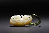 A WHITE JADE 'DOUBLE DUCK' PENDANT WITH SKIN