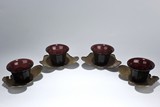 A SET OF GLASS CUPS WITH SILVER STANDS