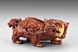 AN BONE CARVED BUDDHIST LION