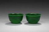 A PAIR OF GREEN PEKING GLASS BOWLS