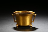 A GILT-BRONZE TRIPOD CENSER