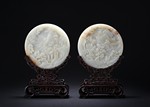 A PAIR OF WHITE JADE CIRCULAR 'IMMORTALS' TABLE SCREENS