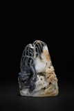A BLACK AND WHITE JADE CARVED BOULDER