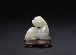 A WHITE JADE CARVED MYTHICAL BEAST