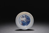 A BLUE AND WHITE UNDERGLAZED-RED 'FLOWER' DISH