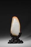 A NATURALISTIC WHITE JADE CARVED BOULDER