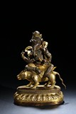 A GILT BRONZE FIGURE OF GANESHA