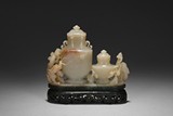 A WHITE JADE LINKED VASE WITH SPINACH JADE STAND
