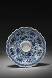 A BLUE AND WHITE 'FLORAL SCROLL' DISH