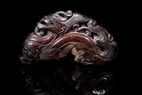 A JADE CARVED 'DRAGON' SHAPE PENDANT