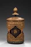A LARGE TIBETAN GILT-BRONZE PRAYER WHEEL
