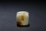 A WHITE JADE 'TAOTIE' ARCHER'S RING