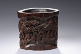 AN AGARWOOD CARVED 'FIGURE' BRUSHPOT