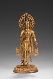 A STANDING GILT-BRONZE BODHISATTVA