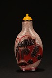 A DARK BROWN AND RED OVERLAY 'KATYDID' WHITE GLASS SNUFF BOTTLE