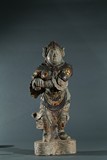 A STONE CARVED GILT INLAID FIGURE OF LISHI