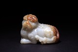 A WHITE JADE MYTHICAL BEAST CARVING