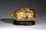A GILT-BRONZE GEMS-INLAID MELON-SHAPED BOX