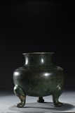 A BRONZE TRIPOD CENSER