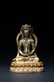 A GILT-BRONZE FIGURE OF AMITAYUS