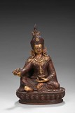 A PARCEL-GILT BRONZE GURU FIGURE