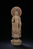 A STONE CARVED STANDING BODHISATTVA