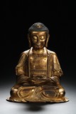A GILT-BRONZE FIGURE OF AMITABHA