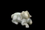 A CELADON JADE 'GOAT' CARVING