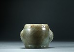 A CELADON JADE CARVED 'DRUM' PAPER WEIGHT