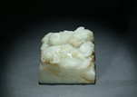 A WHITE JADE 'DRAGON' PAPER WEIGHT